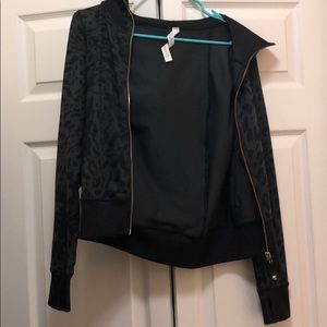 Black leopard lululemon zip up. Barely worn.